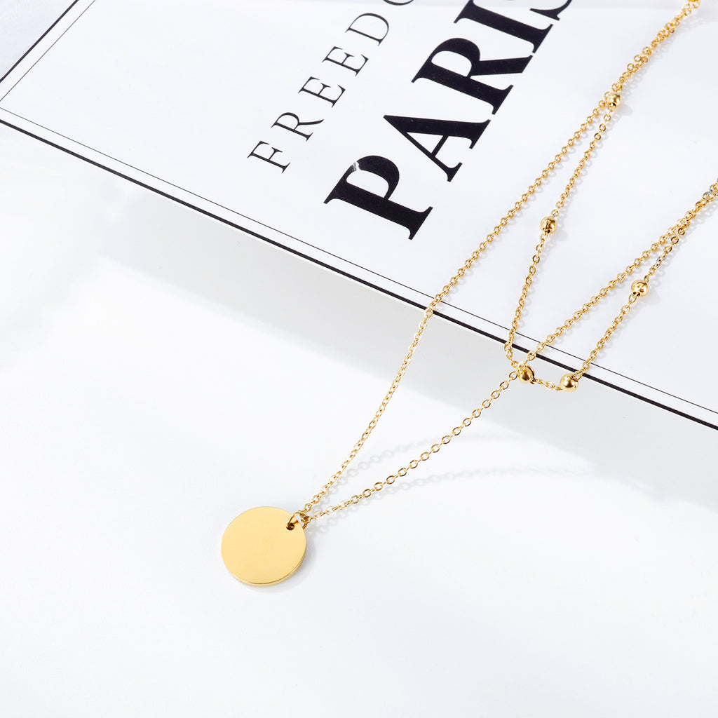 NEHZUS Petite chaîne de perles rondes double couche classique et polyvalente avec pendentif rond brillant pour collier de clavicule pour femme