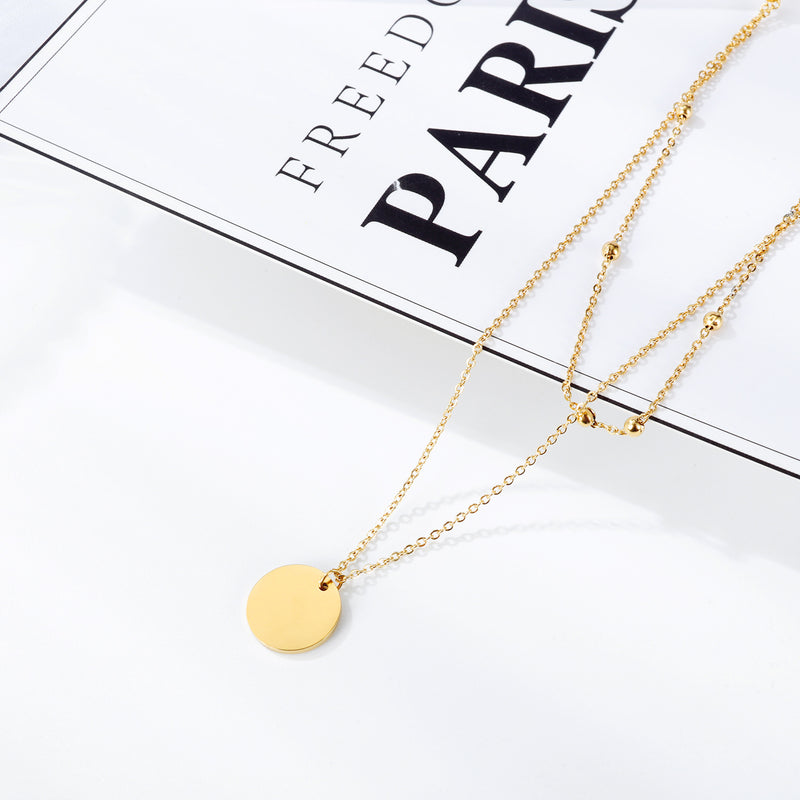 NEHZUS Petite chaîne de perles rondes double couche classique et polyvalente avec pendentif rond brillant pour collier de clavicule pour femme