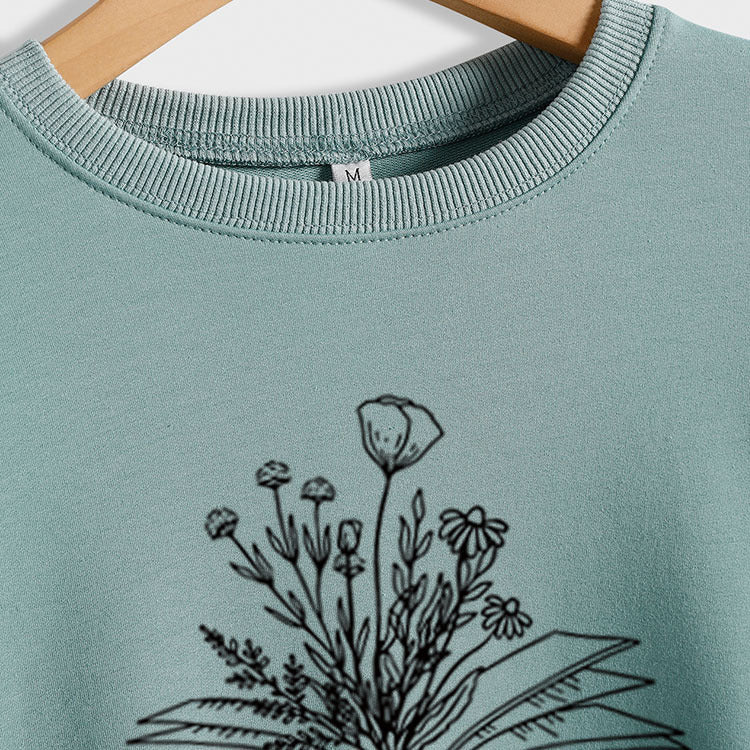 Pull décontracté imprimé à manches longues et ample de grande taille à col rond