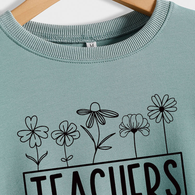 Pull ample à manches longues et col rond avec graines de plantes pour enseignants