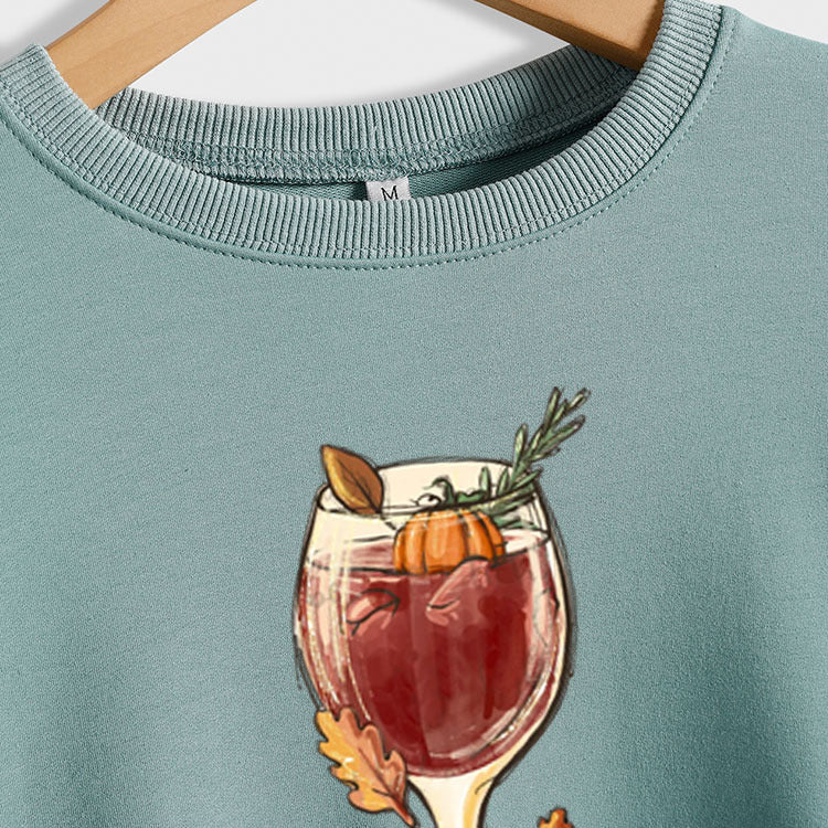 Pull ample à manches longues imprimé citrouille en verre de vin rouge